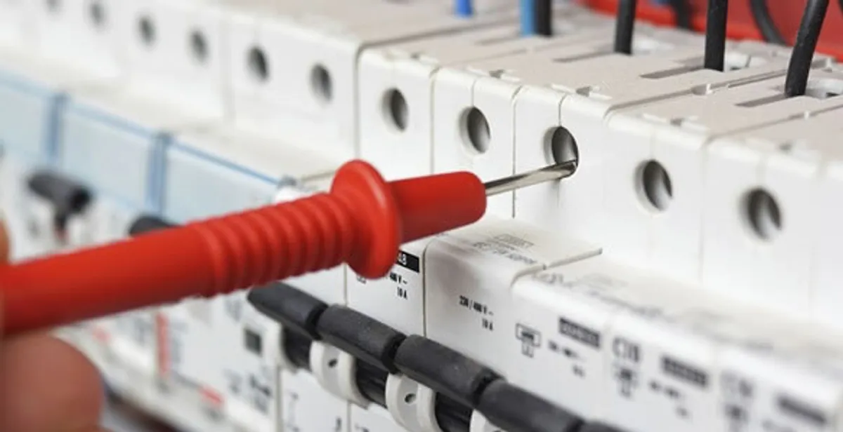 Electrical contractor testing circuit breakers during electrical repair in Mustang, OK