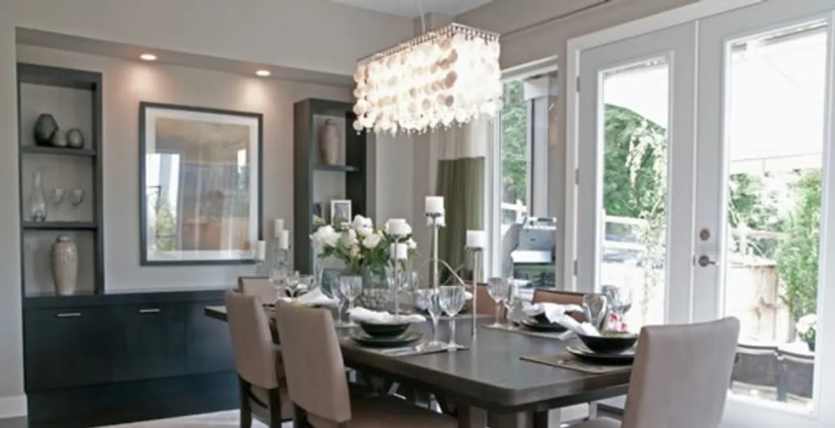 Elegant dining room chandelier installation above table in Oklahoma City, OK