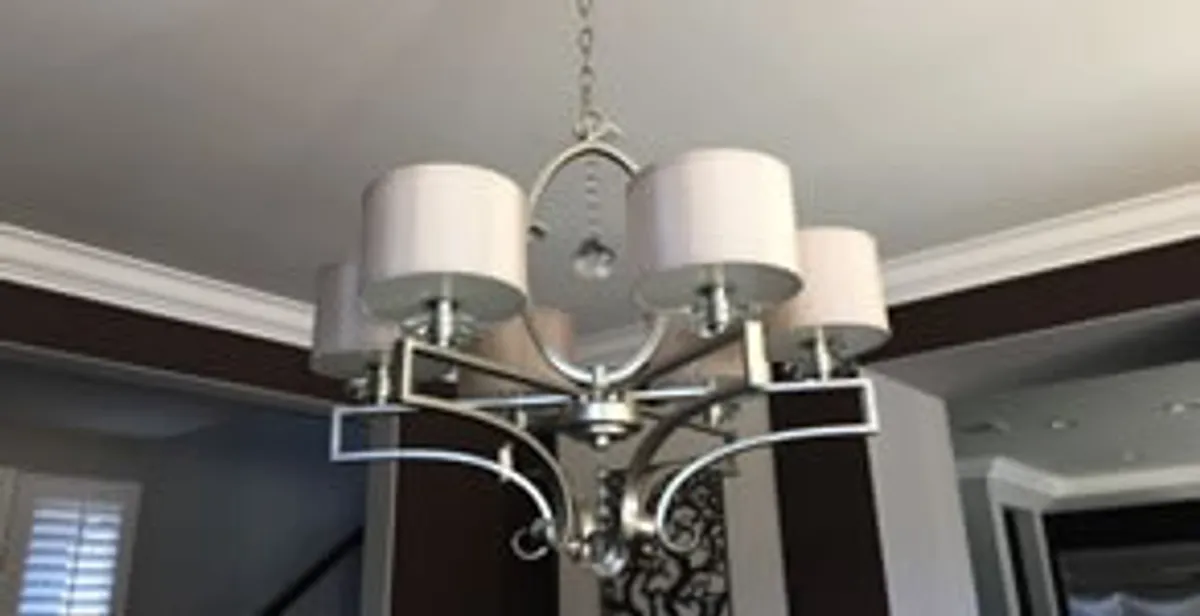 Modern chandelier installation with multiple light fixtures in Oklahoma City, OK